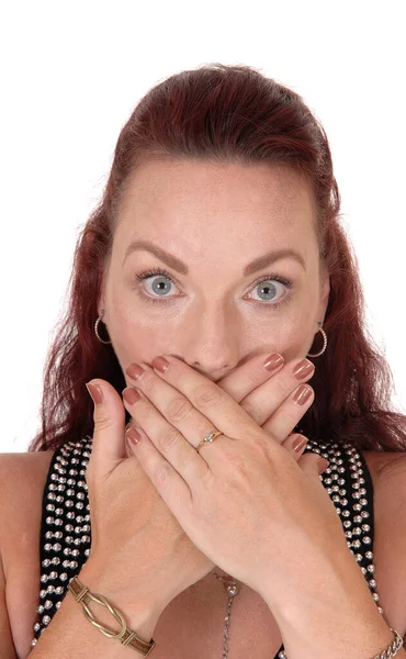Woman with her hands over her mouth — Stock Photo, Image