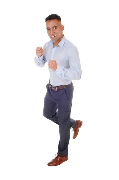 Young man running in studio — Stock Photo, Image