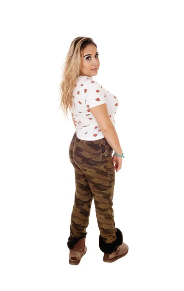 Lovely young woman in camouflage pants — Stock Photo, Image