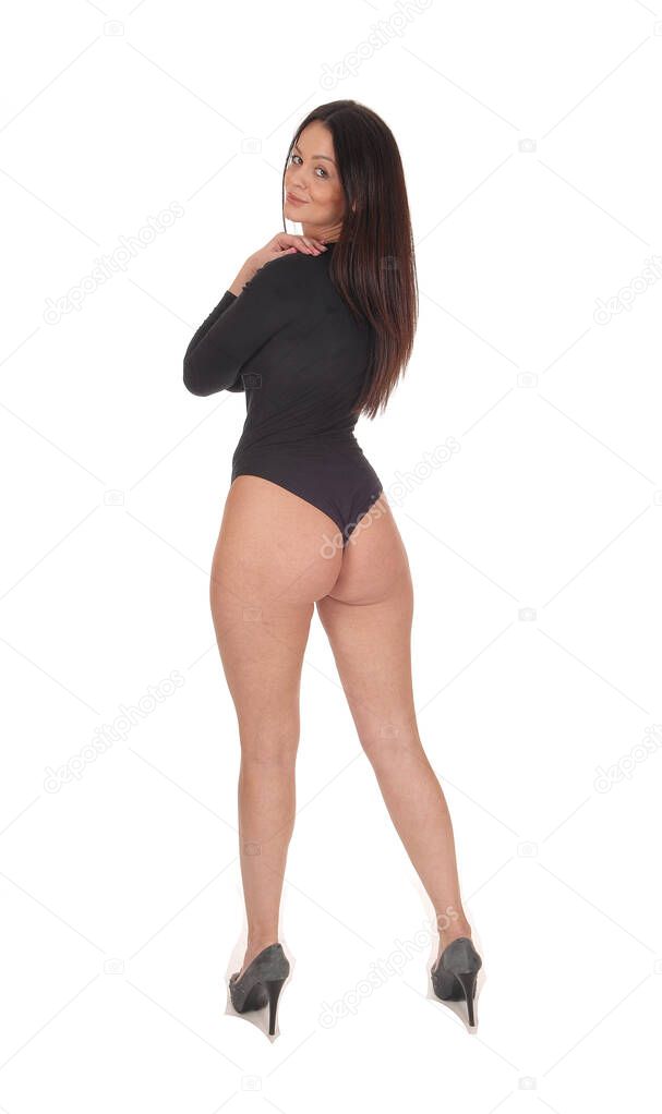 A young beautiful woman standing from the back in a black body sui