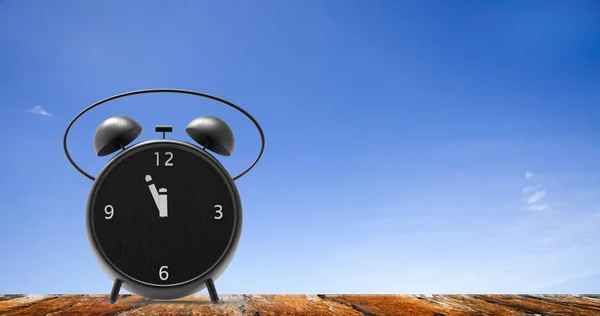 Alarm clock with little minutes to twelve o'clock — Stock Photo, Image