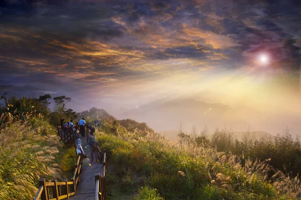 Stone stairs with wooden railing in the mountains at sunset, Tai