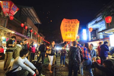 Tourists Launching Sky Lantern Along Railway Next to Shifen Trai clipart