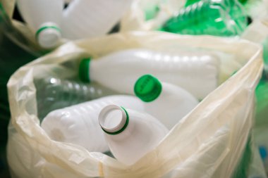 Used white and green plastic in the white bags