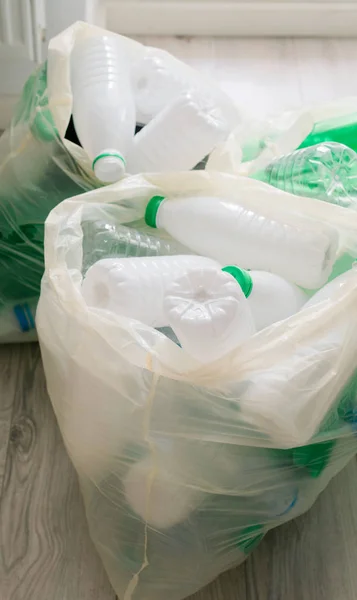 Used white and green plastic in the white bags — ストック写真