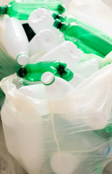 Used white and green plastic in the white bags — Stockfoto