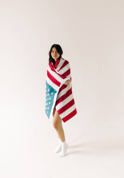 young woman with us flag on the white background