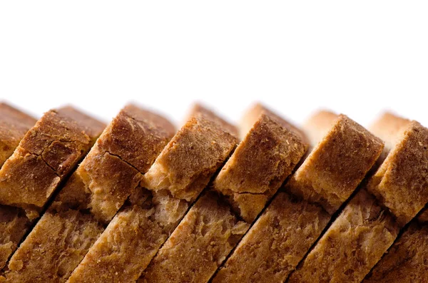 Brot in Scheiben auf einem Brett — Stockfoto