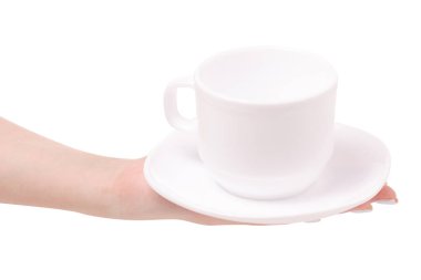 Beyaz fincan ve bir kadın elinde fincan tabağı