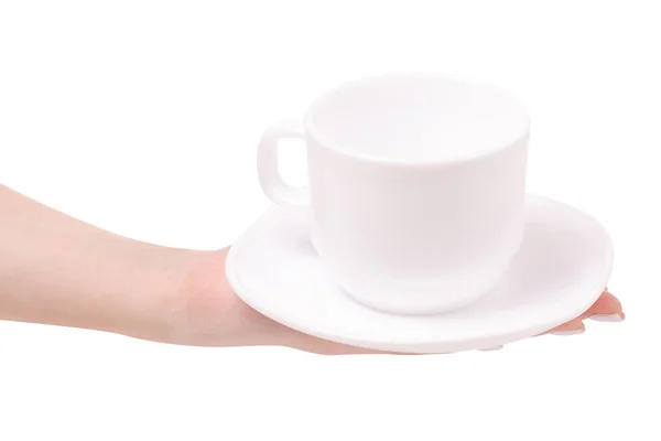 Taza blanca y platillo en una mano femenina — Foto de Stock