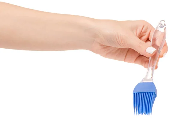 Silicone kitchen brush in hand — Stock Photo, Image