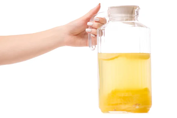 Decanter with a lemonade of hands — Stock Photo, Image