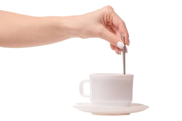 Tasse und Untertasse mit einem Teelöffel in der Hand Tee Kaffee — Stockfoto