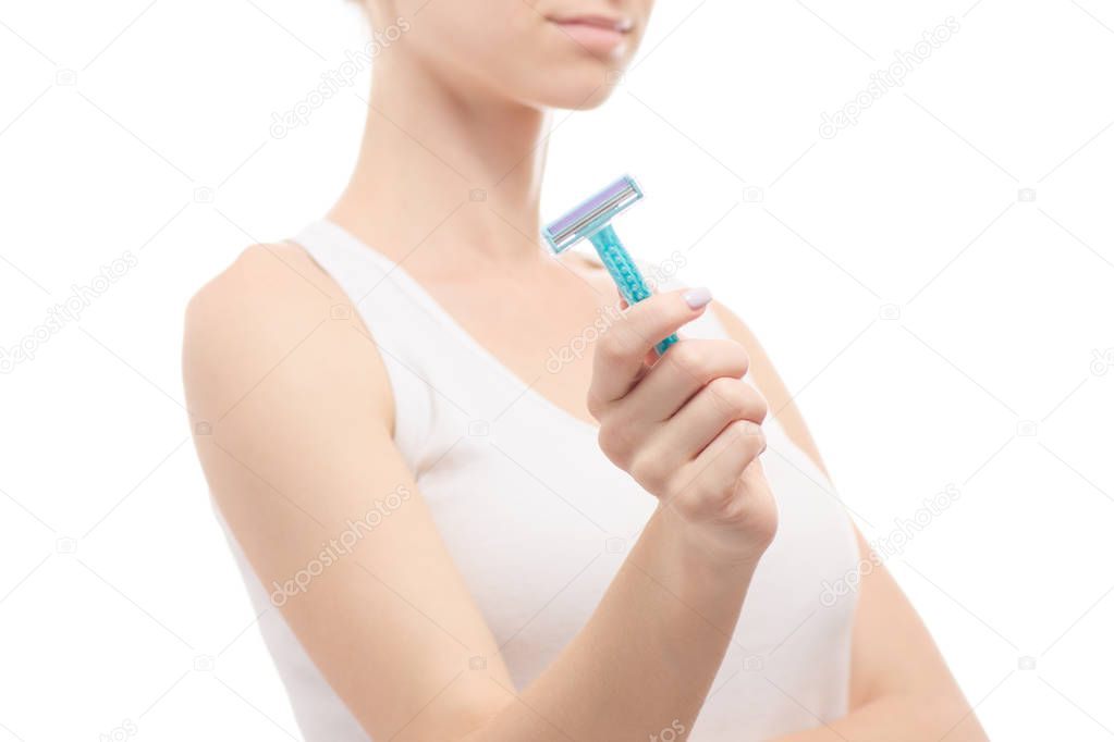 Woman in hand razors shaving