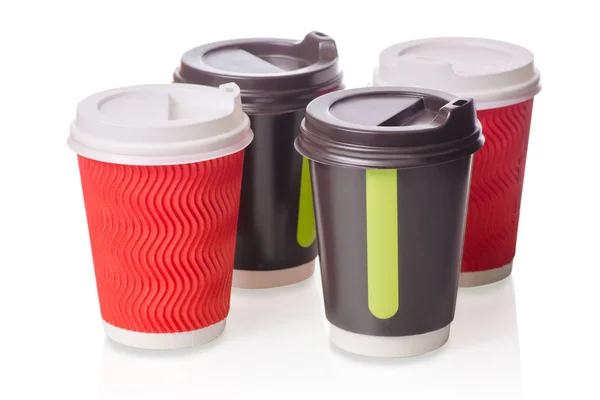 Чотири картонні чашки кави — стокове фото