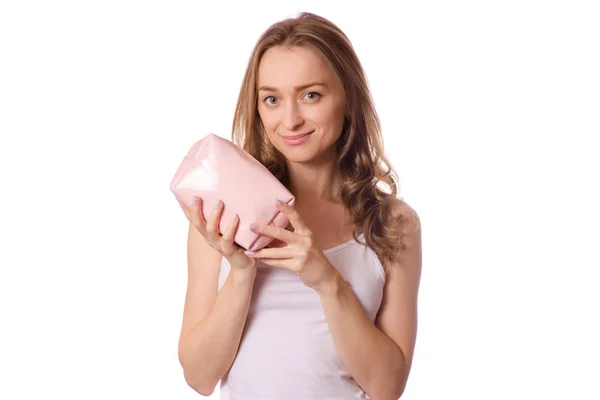 Beautiful young woman cosmetic bag in hands — Stock Photo, Image