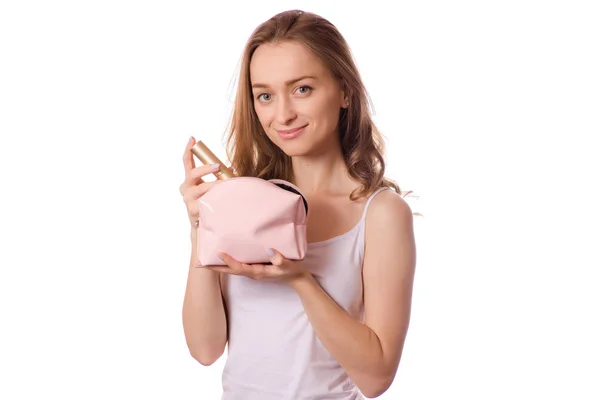 Schöne junge Frau Kosmetiktasche in den Händen Pinsel für Make-up — Stockfoto