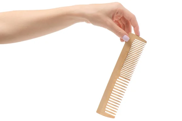 Female hand wooden comb — Stock Photo, Image