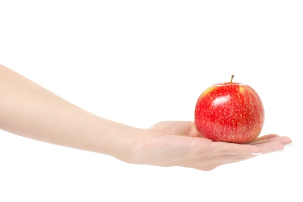 Mano femminile che tiene una mela rossa — Foto Stock
