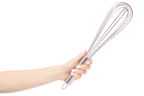 Female hand with a kitchen whisk — Stock Photo, Image