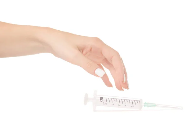 Vrouwelijke hand met een injectiespuit — Stockfoto