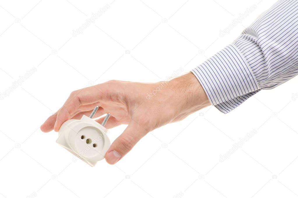 Male hand holding a tee in a white socket