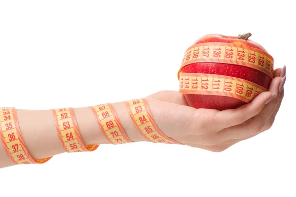 Сантиметр яблука в руці здоров'я втрата ваги — стокове фото