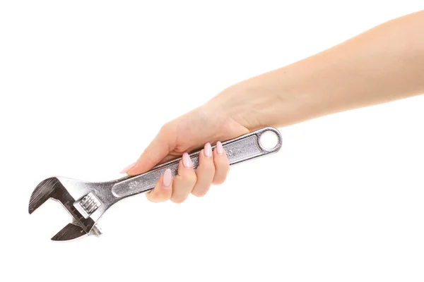 Skiftnyckel i en kvinnas hand — Stockfoto