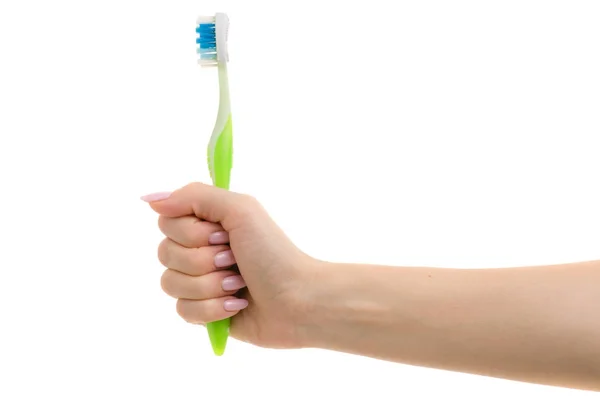 Brosse à dents dans une main féminine — Photo