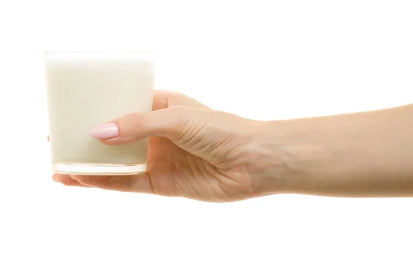 A glass of milk in female hands — Stock Photo, Image