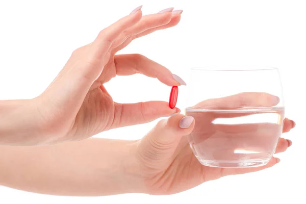 Vidro de comprimido de água na mão — Fotografia de Stock