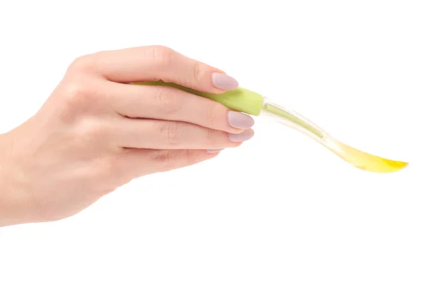 Weibliche Hand Baby Löffelnahrung isoliert — Stockfoto