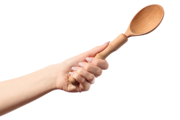 Kitchen wooden spoon in hands — Stock Photo, Image
