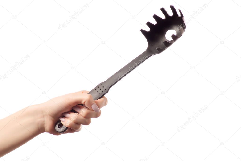 Spaghetti spatula in hands