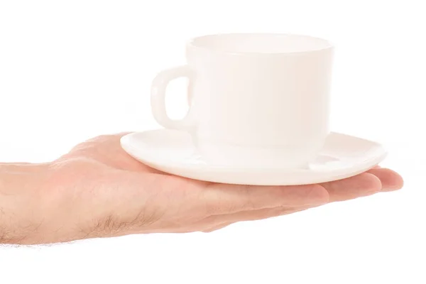 Белая чашка и блюдце в руке — стоковое фото