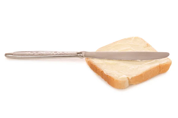 Chleb z masłem nóż w ręku — Zdjęcie stockowe