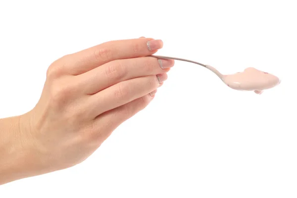 Yogurt spoon in hand — Stock Photo, Image