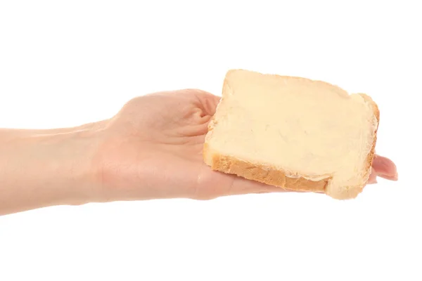 Bröd med smör i hand — Stockfoto