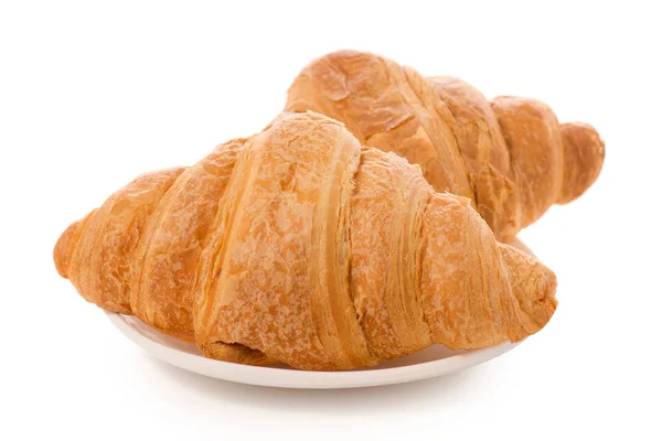 Croissants auf einem weißen Teller isoliert — Stockfoto