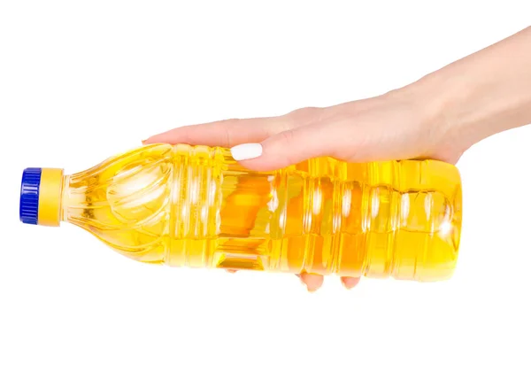 Flasche Sonnenblumenöl in der Hand — Stockfoto