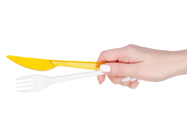 Plastová vidlička a nůž v ruce — Stock fotografie