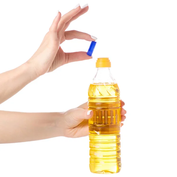 Uma garrafa de óleo de girassol na mão — Fotografia de Stock