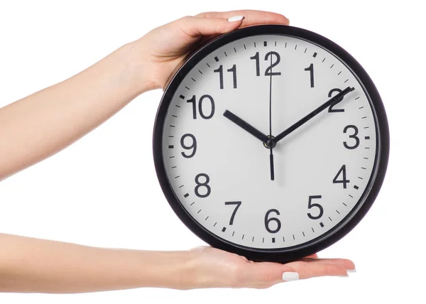 Wall clock in hand Royalty Free Stock Photos