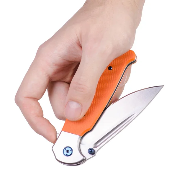 Cuchillo plegable con mango naranja en mano —  Fotos de Stock