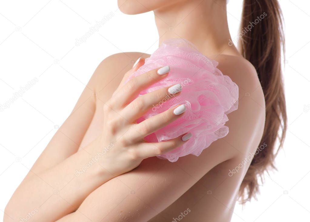 Beautiful young woman shoulder a bath sponge