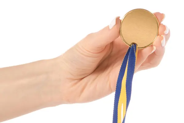Altın madalya Şerit'teki elinde — Stok fotoğraf
