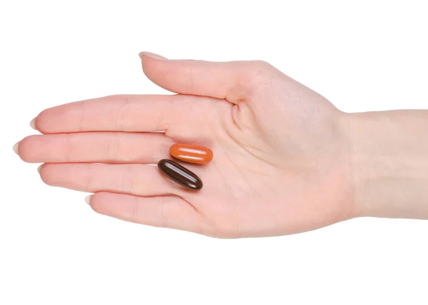 Due pillole in una mano — Foto Stock