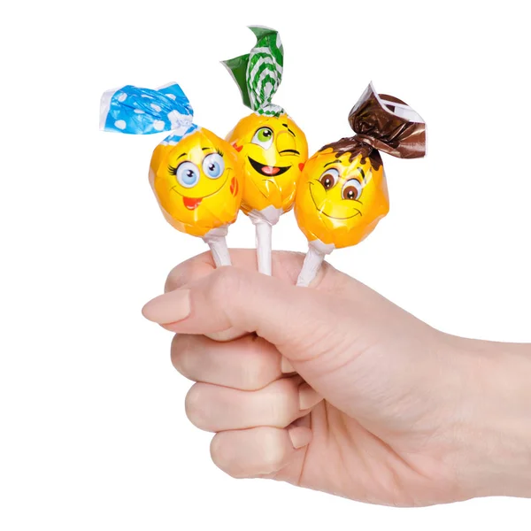 Chupa chups Süßigkeiten in der Hand lächelt — Stockfoto