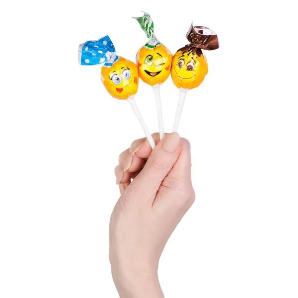 Chupa chups Süßigkeiten in der Hand lächelt — Stockfoto