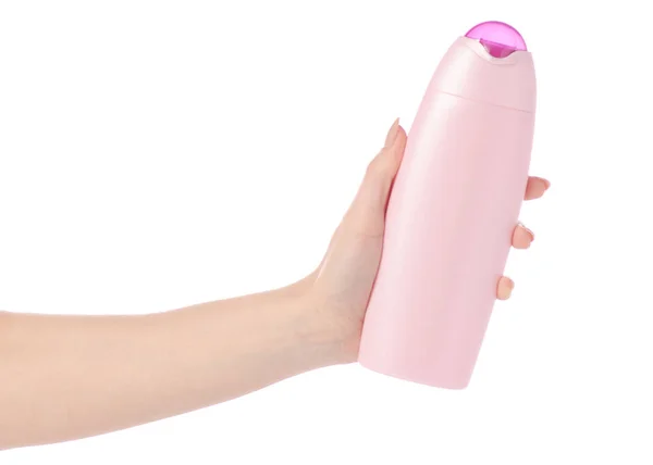 Gel de chuveiro em frasco de plástico rosa na mão — Fotografia de Stock